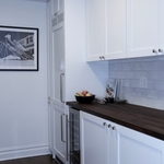Custom cabinetry, new pantry, built-in refrigerator, built-in washer/dryer, wine fridge.