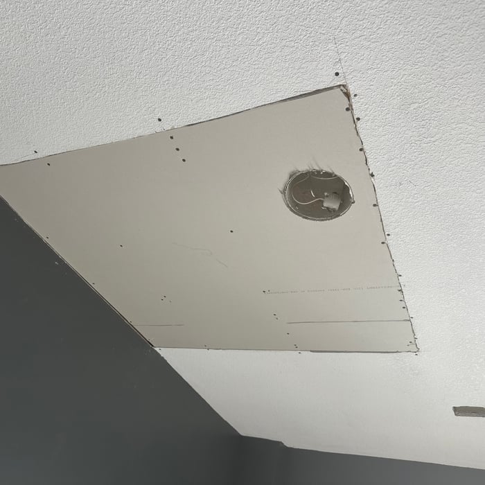 Tore out all of the water damaged area and rehung it.