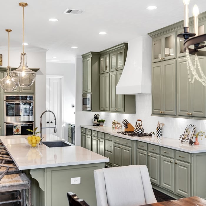 We brought some of the cabinets to the 10' ceiling height and added so special can lights with dimmer in the boxes with glass