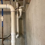 New condensate line property piped into existing house sewer to code