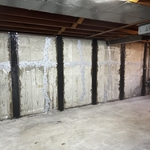 Carbon fiber straps and structural injections applied to cracked and bowing foundation wall