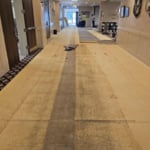 Before corridor carpet installation.