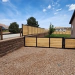 Horizontal fence on retaining wall