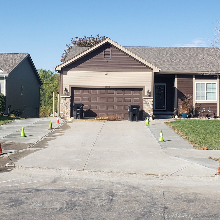 Wider approach to accommodate 4' walkway to home's entry to avoid having to step out of vehicle on to grass