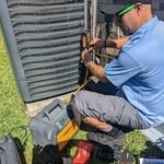In this Picture we have Danny one of are Awesome techs Finishing up installing a Compressor and is now in the stage of pulling a vacuum, to make sure we have zero moisture in the line set.