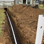 Excavate front yard to expose old sewer line. Install shoring for safety at depths greater than 5’. Remove old sewer line and install new PVC sewer. Make connections to remaining pipe with underground couplings. Water test to ensure proper drainage with no leaks and encase new pipe in stone for support and protection. Remove shoring and backfill with existing soil. Tamp soil and grade trench.