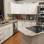 New Shaker style doors and drawer fronts with everything finished to match with Sherwin Williams Emerald Urethane satin sheen Dover White including installation of new hardware and soft close hinges from Richelieu Hardware.