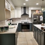 After new Shaker style doors and drawer fronts with everything finished to match with Sherwin Williams Emerald Urethane satin sheen including installation of new hardware and a new lazy Susan plus creation of a microwave cabinet