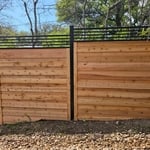 Custom iron/wood combo fence install.