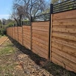 Custom iron/wood combo fence install.
