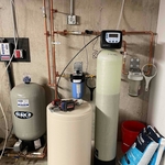 Water filtration systems installed in basement of home.
