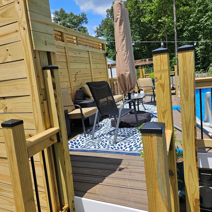 Above ground pool deck with privacy fence