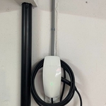 Electrical charging station installed in garage of home.