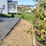 Corner of patio and erosion blanket over new seed and soil
