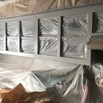 Cabinet frames after being sprayed with premium grade cabinet paint