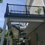 Overall view of the newly constructed back deck, which leads to the now covered patio area, via the spiral staircase.
