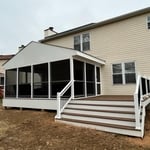 Screened-in Porch and Deck on the backyard. Trex composite materials and Shingle Roofing.