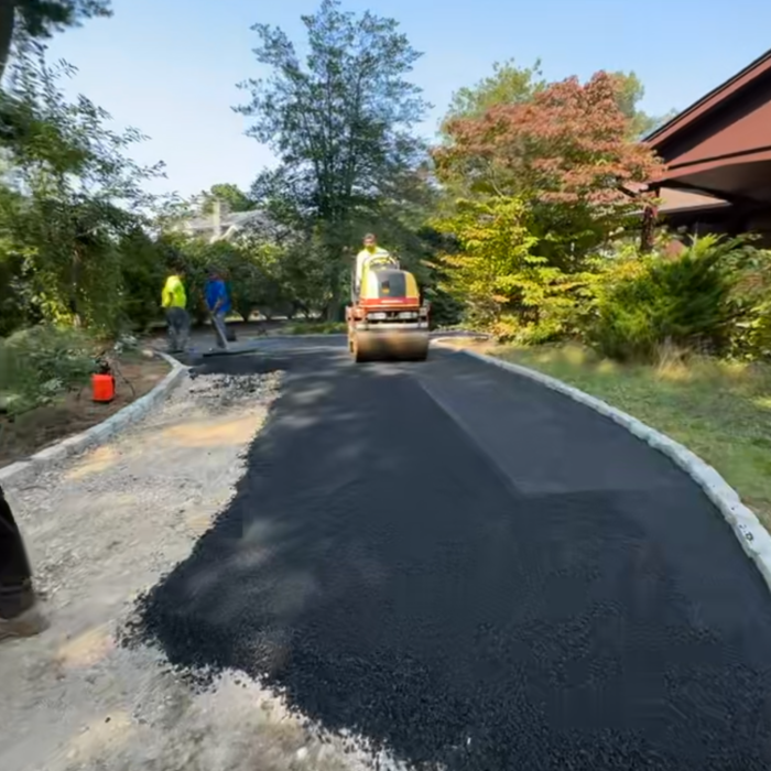 Asphalt driveway with pavers