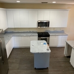 Cabinet sprayed in white, countertops sprayed in marble.