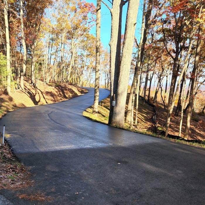 Sealcoating driveway our performance was cleaned blowed off edges was cut out grass we provided our sealcoating rejuvenates cracks to winterizing to restore driveway