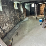 French drain all around the basement, 2 feet deep with perforated pipe and discharge drain well.