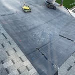 Dimensional shingle transitioned to a rubber flat roof
