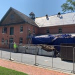 Preparing the East side of the building for new cedar shakes.