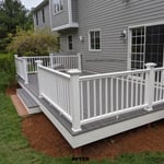 Deck Upgrade in Halifax, MA. Old deck boards were removed and new AZEK decking in Island Oak with Premier White railings were installed.