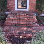 Old front stoop. We removed the brick and added a new entryway.