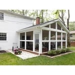 Because the homeowners wanted an unobstructed view and ventilation for their firepit table, screens are run from floor to ceiling along the walls. Added screened entry doors on both sides provide easy access to the room from the yard and adjoining patio.