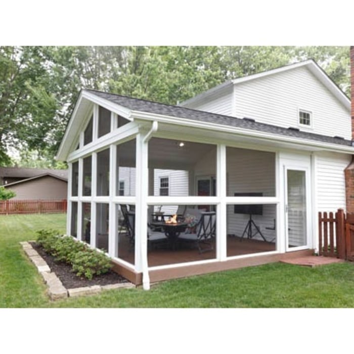 Because the homeowners wanted an unobstructed view and ventilation for their firepit table, screens are run from floor to ceiling along the walls. Added screened entry doors on both sides provide easy access to the room from the yard and adjoining patio.