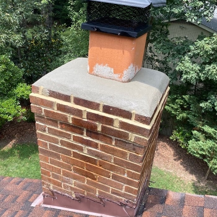 New concrete crown and repointed top 3 courses of mortar joints