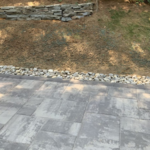 Patio with drainage and retaining wall