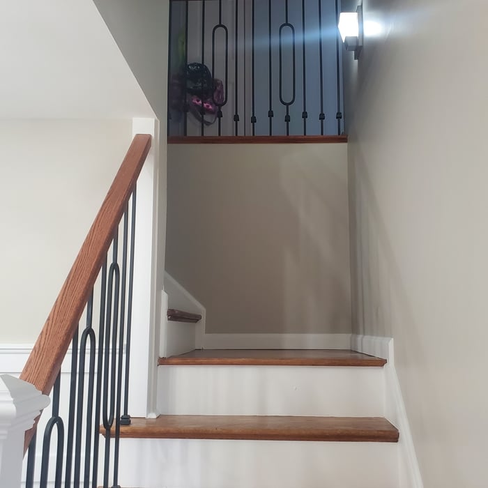 Stair way we painted the rizers post and stained and polyurethaned the rails.
