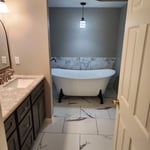 Bathroom closet conversion for freestanding tub.