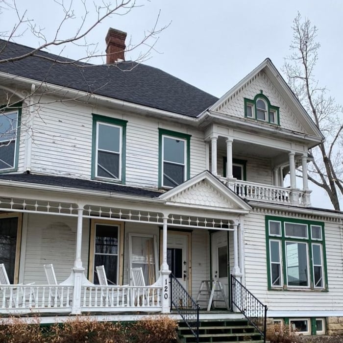 BEFORE: Peeling paint, water damage to the walls and foundation, and leaky windows were causing this house to show her age.
