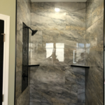 Swapped builder plastic shower for custom tile
