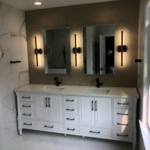 All tile bath with lighted med cabinets that are off. I will have to swap this picture out