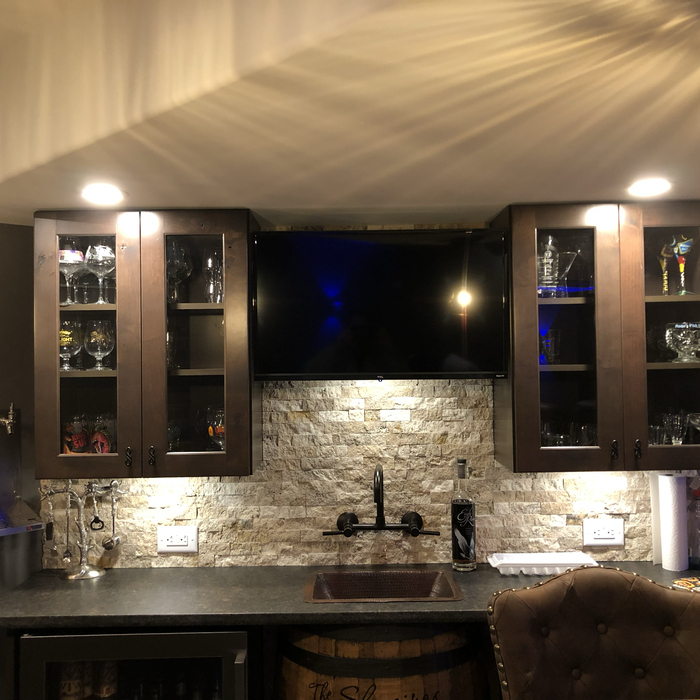 Back bar in basement. We ran the keg lines in an insulated duct in a loop to and from the refrigerator to circulate cold air around the lines. Saved him money on getting a glycol line cooler