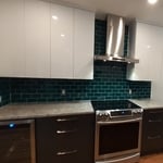 After Pictures of a kitchen Refacing project by Visions.
Shown in a Two Toned High Gloss White Lacquer Wall Cabinets and Grey Lacquer Base Cabinets.