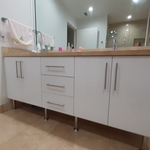 We Refaced this bathroom vanity with High Gloss White Lacquer Cabinet Door and Drawer Fronts.