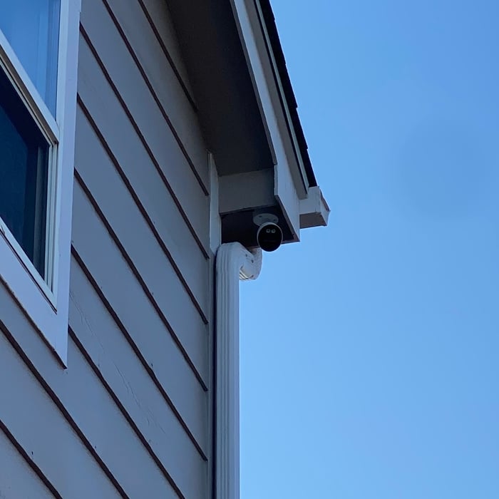 Active deterrent surveillance camera