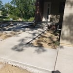 Sidewalk and new build, pre-landscaping.