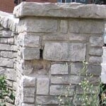 Before tuckpointing – note the cracked and missing mortar and stone.