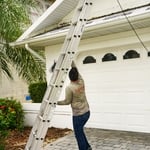 Roman employee setting up ladder