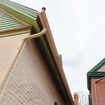 Victorian-style home in Whittier neighborhood in Denver with half-round gutters.