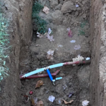 Installation of a tee with a valve for future irrigation connection.