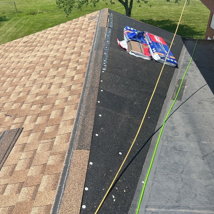 This photo shows us being nearly halfway done with installing new shingles on this roof!