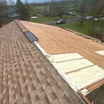 Because the roof was blown away, we installed some new wood for the tarp to be adhered to.