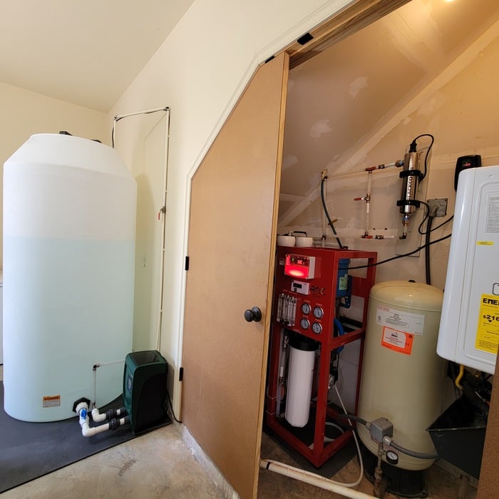 A 4000 gallon per day Reverse Osmosis system with UV and 300 gallon storage tank.